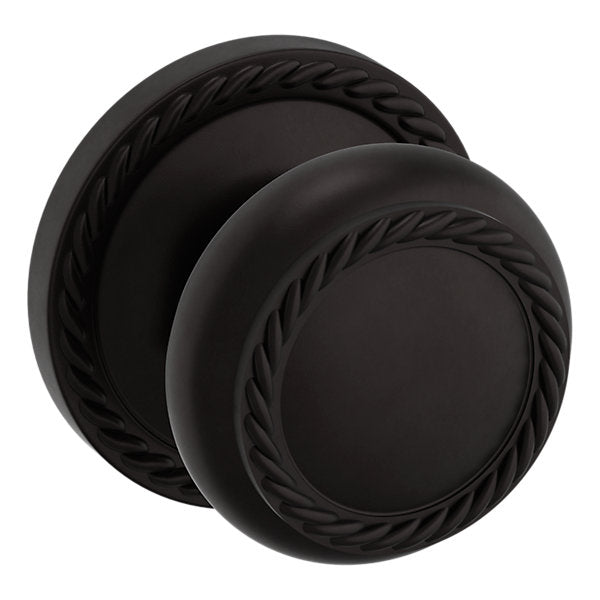 Baldwin Hardware Perilla 5064 con Roseta 5004 — Bronce aceitado — Paso
