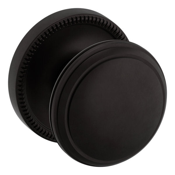 Baldwin Hardware Perilla 5069 con Roseta 5076 — Bronce aceitado — Paso