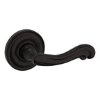 Baldwin Hardware Manija 5108 con Roseta 5048 — Bronce aceitado — Paso
