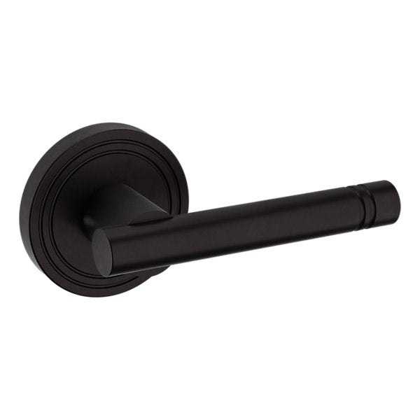 Baldwin Hardware Manija 5138 con Roseta 5047 — Bronce aceitado — Paso