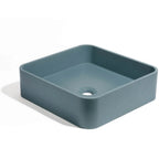 Lavabo de concreto cuadrado en color azul profundo