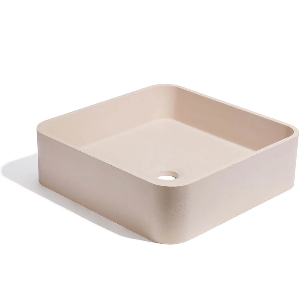 Lavabo de concreto cuadrado en color rosa crudo