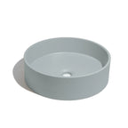 Lavabo de concreto circular en color azul somero