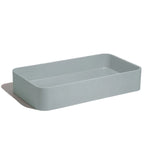 Lavabo de concreto rectangularmarca Mistoa en color azul somero