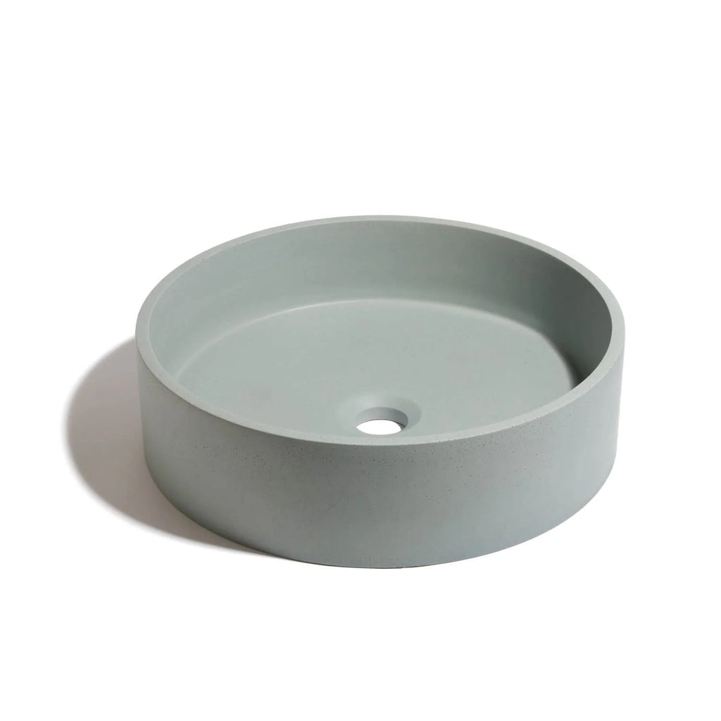 Lavabo de concreto circular marca Mistoa en color azul somero