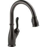 Delta Leland® Llave de una manija con tubo de salida deslizable para cocina