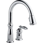 Delta Victorian™ Llave de una manija con tubo de salida deslizable para cocina