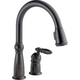 Delta Victorian™ Llave de una manija con tubo de salida deslizable para cocina